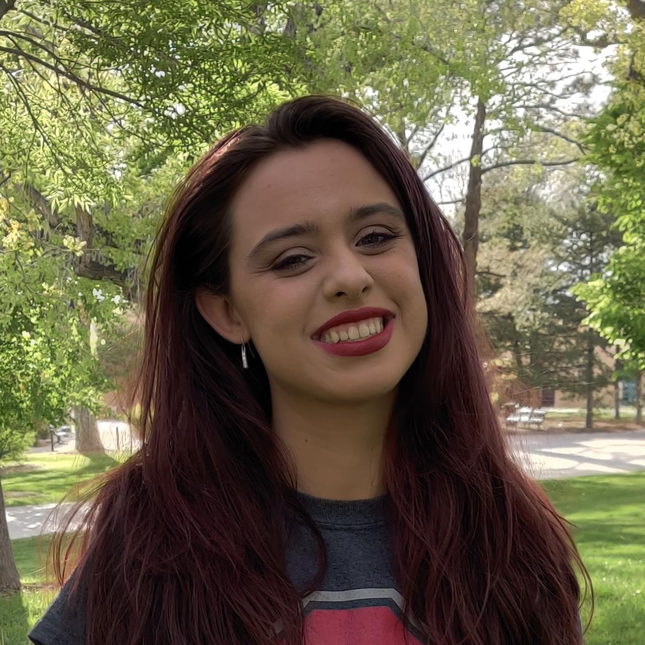 Kimberly Denman smiling in the outdoors